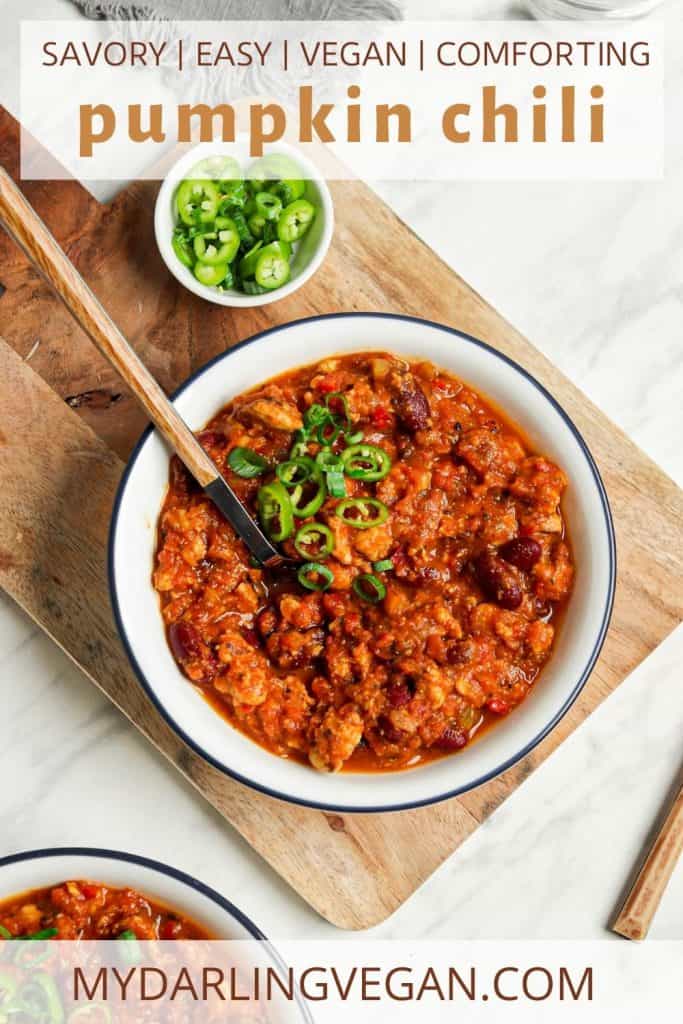 Pinterest graphic of vegan pumpkin chili in white bowl with green onions