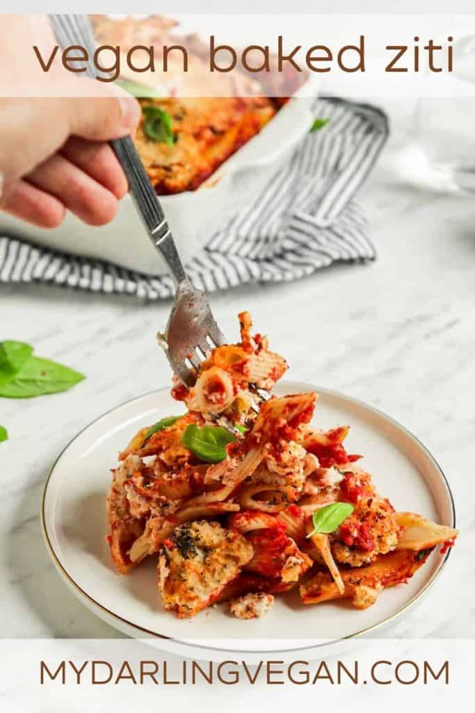 one plate of vegan baked ziti with fork and fresh basil with Pinterest text