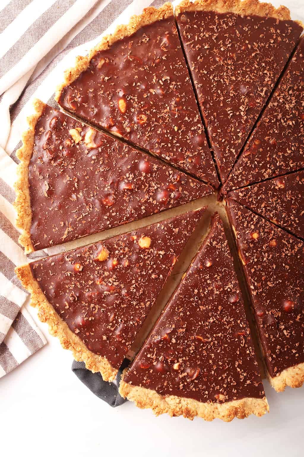 Close up of chocolate tart cut into slices.  