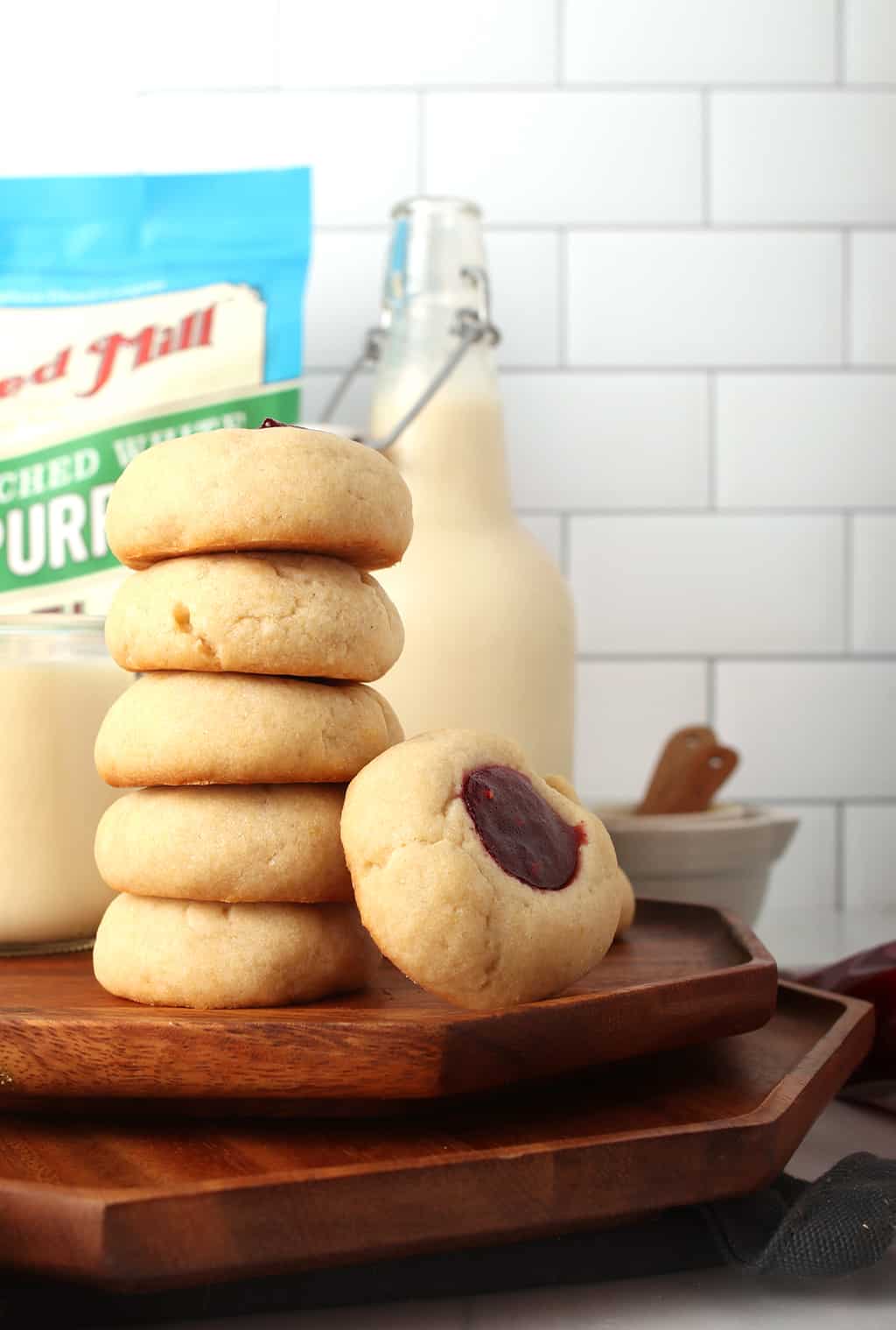 Stack of vegan cookies on a hexagon wooden platter