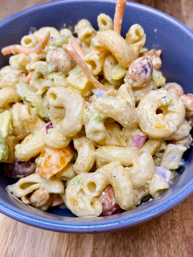 Buffalo chickpea pasta salad in a blue bowl