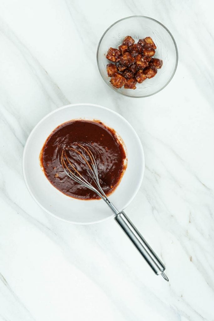 marinating tofu for the bibimbap bowls served with vegan gochujang sauce