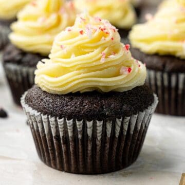 Vegan chocolate peppermint cupcakes with swirled frosting and crushed candy cane topping