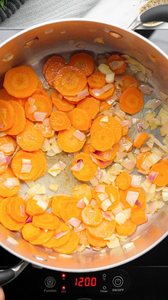 sautéing the aromatics to build our cabbage soup flavor in a pot