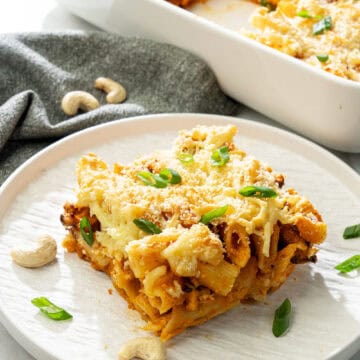 plated vegan buffalo pasta casserole with dairy-free cheese and cashew cream sauce