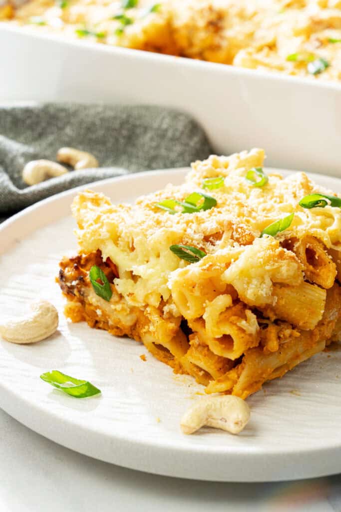 close-up of creamy dairy-free baked buffalo cauliflower pasta with crispy breadcrumb topping