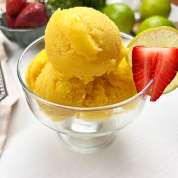 close-up of smooth and creamy vegan mango ice cream in a chilled bowl