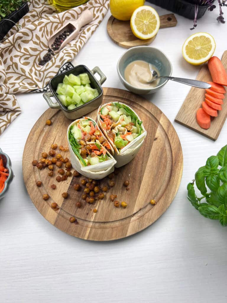 Smashed chickpea wraps with fresh veggies and a creamy dairy-free tahini sauce
