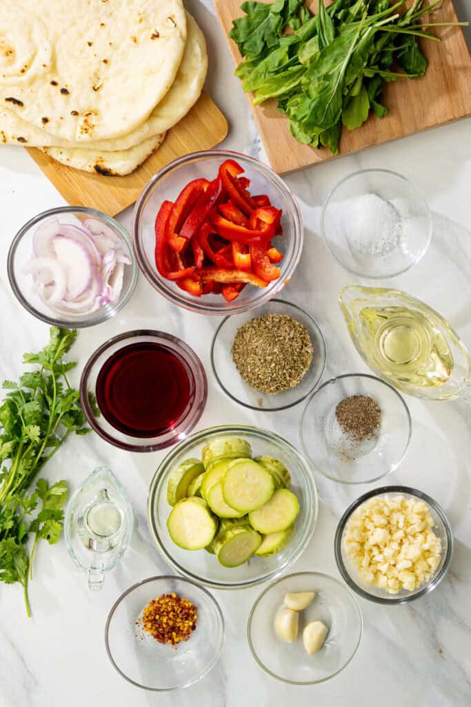 ingredients for grilled vegan flatbread with veggies and herbs for the chimichurri