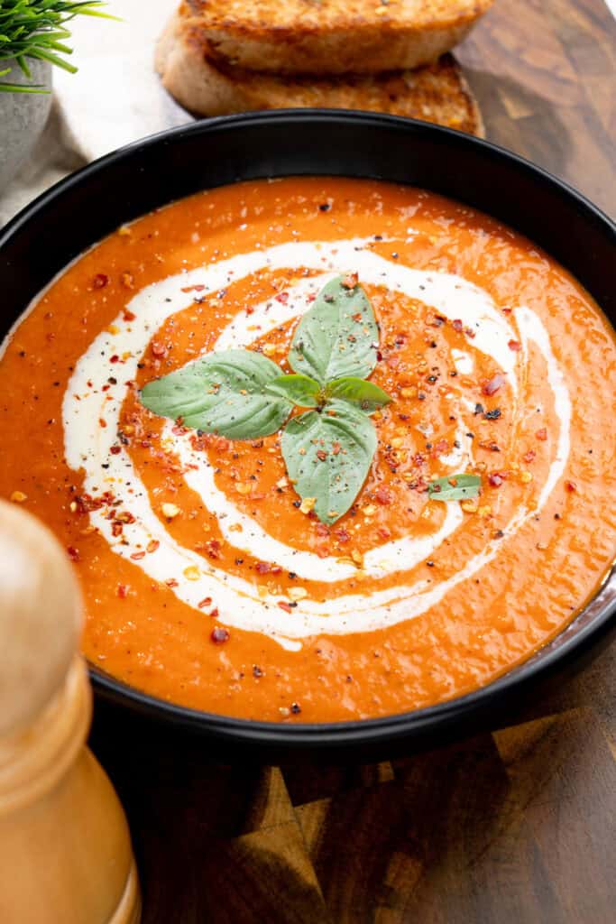 smooth and creamy vegan roasted red pepper and white bean soup ready to eat