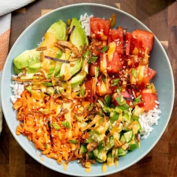 finished watermelon poke bowl with marinated fruit, crisp veggies and warm rice