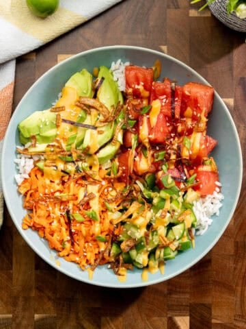 finished watermelon poke bowl with marinated fruit, crisp veggies and warm rice