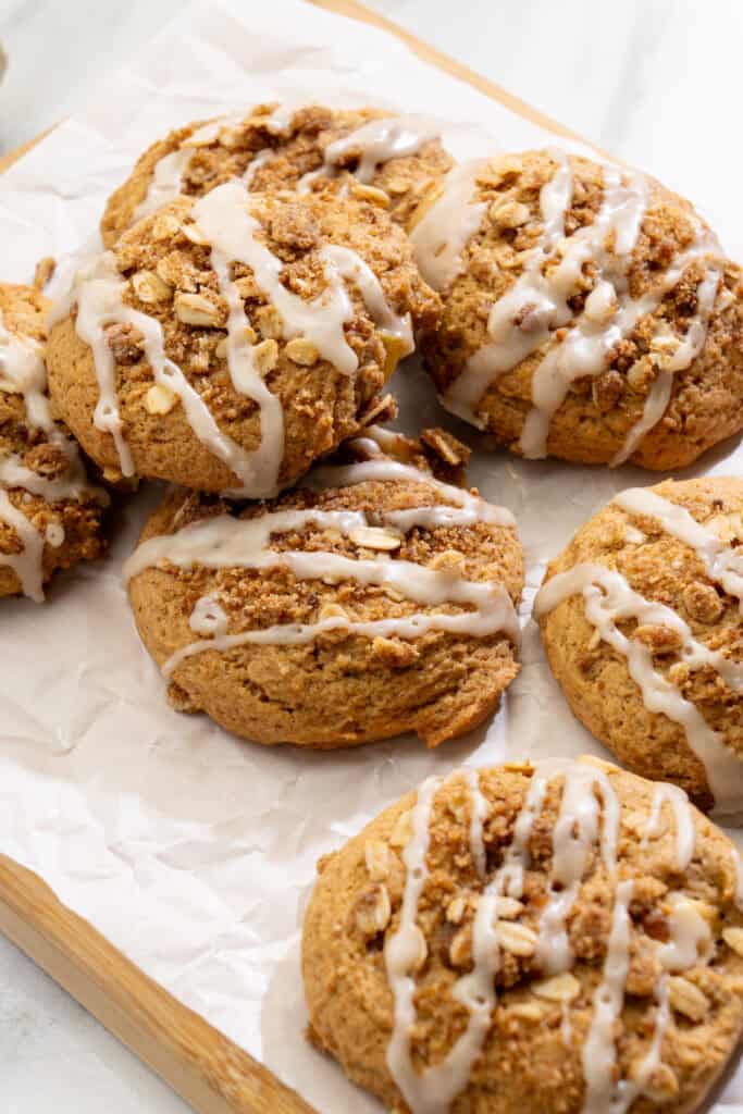freshly baked vegan apple crisp cookies with cinnamon oat crumble and vanilla glaze
