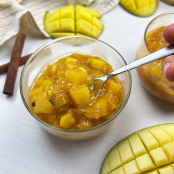 spoonful of chunky homemade mango chutney with tender fruit and warm Indian spices