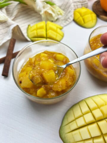 spoonful of chunky homemade mango chutney with tender fruit and warm Indian spices