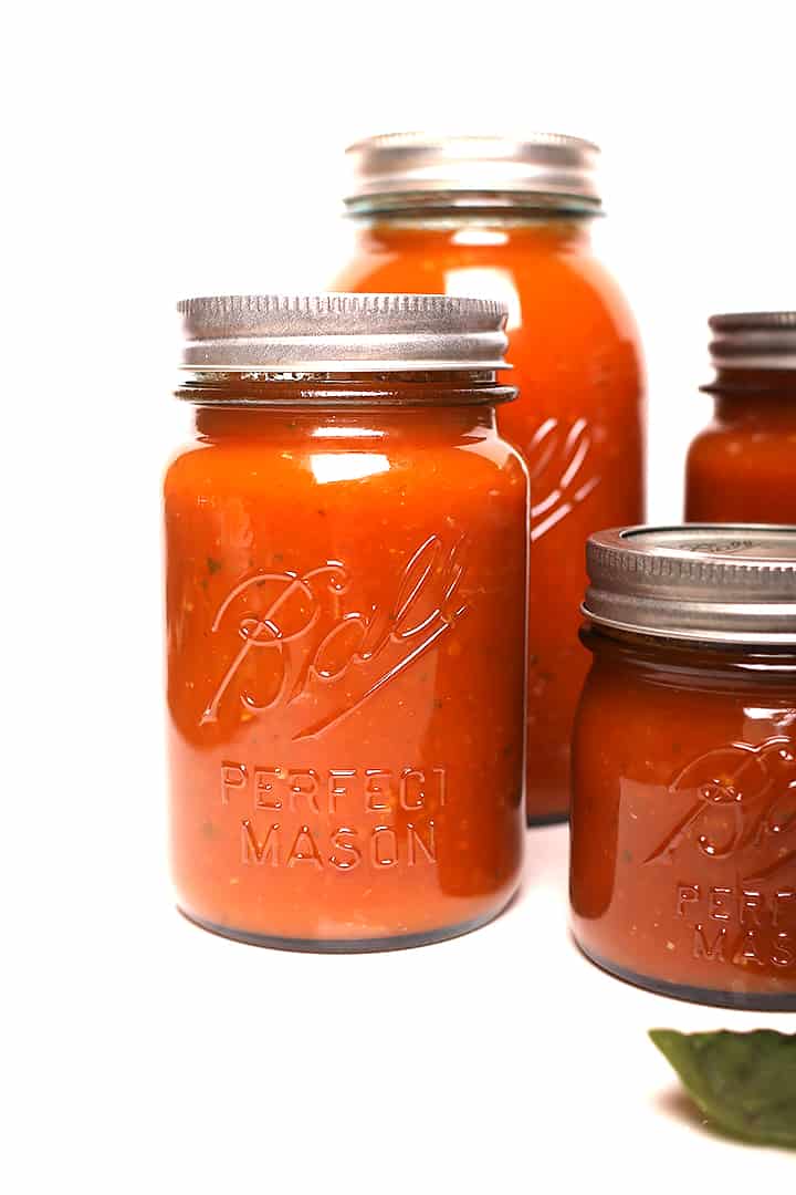 4 Ball jars filled with canned tomato sauce