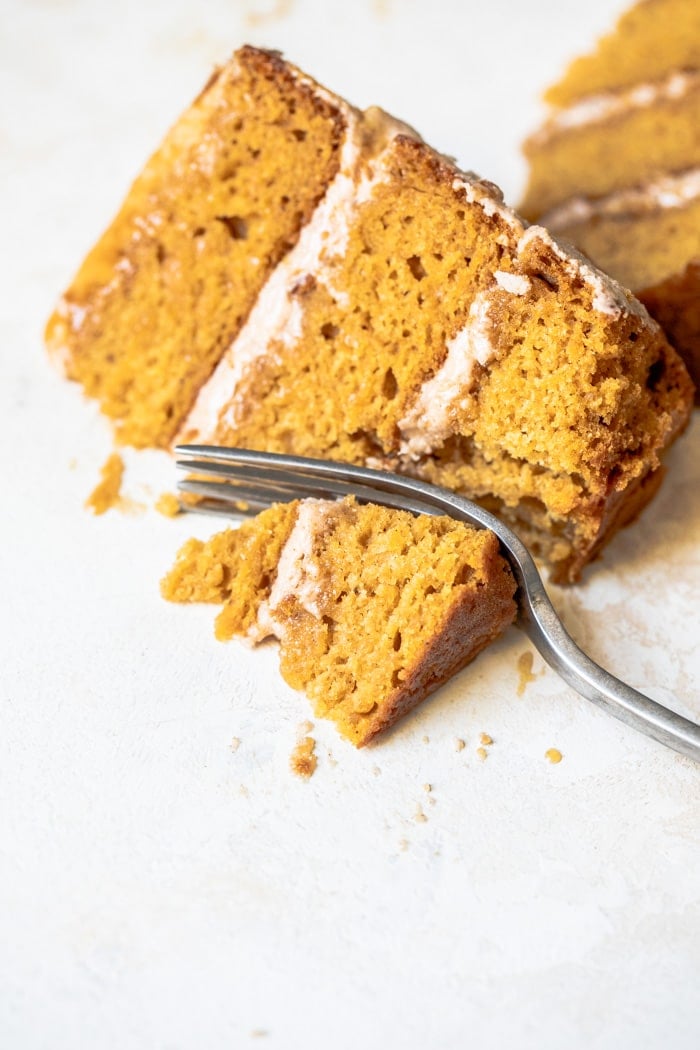 Slice of vegan pumpkin cake on a white plate