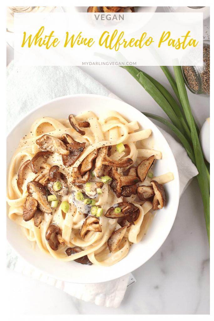 You're going to love this White Wine Vegan Alfredo Pasta. It's a creamy white sauce mixed with Fettucine pasta and sautéed shiitake mushrooms for a delicious and easy weeknight meal. 